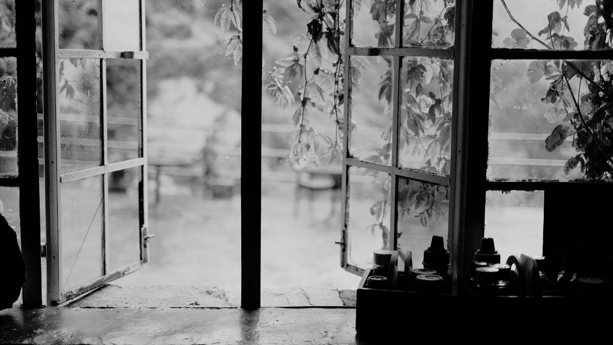 Slightly open window with soft natural light, symbolizing quiet and honest support